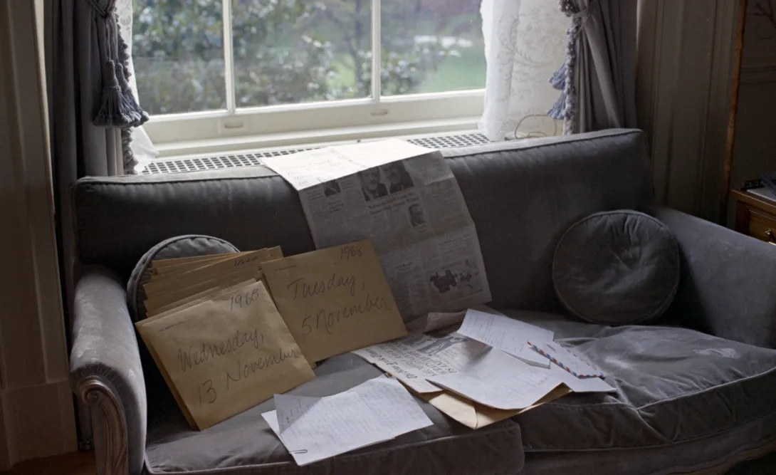 image of couch covered in envelopes and paper